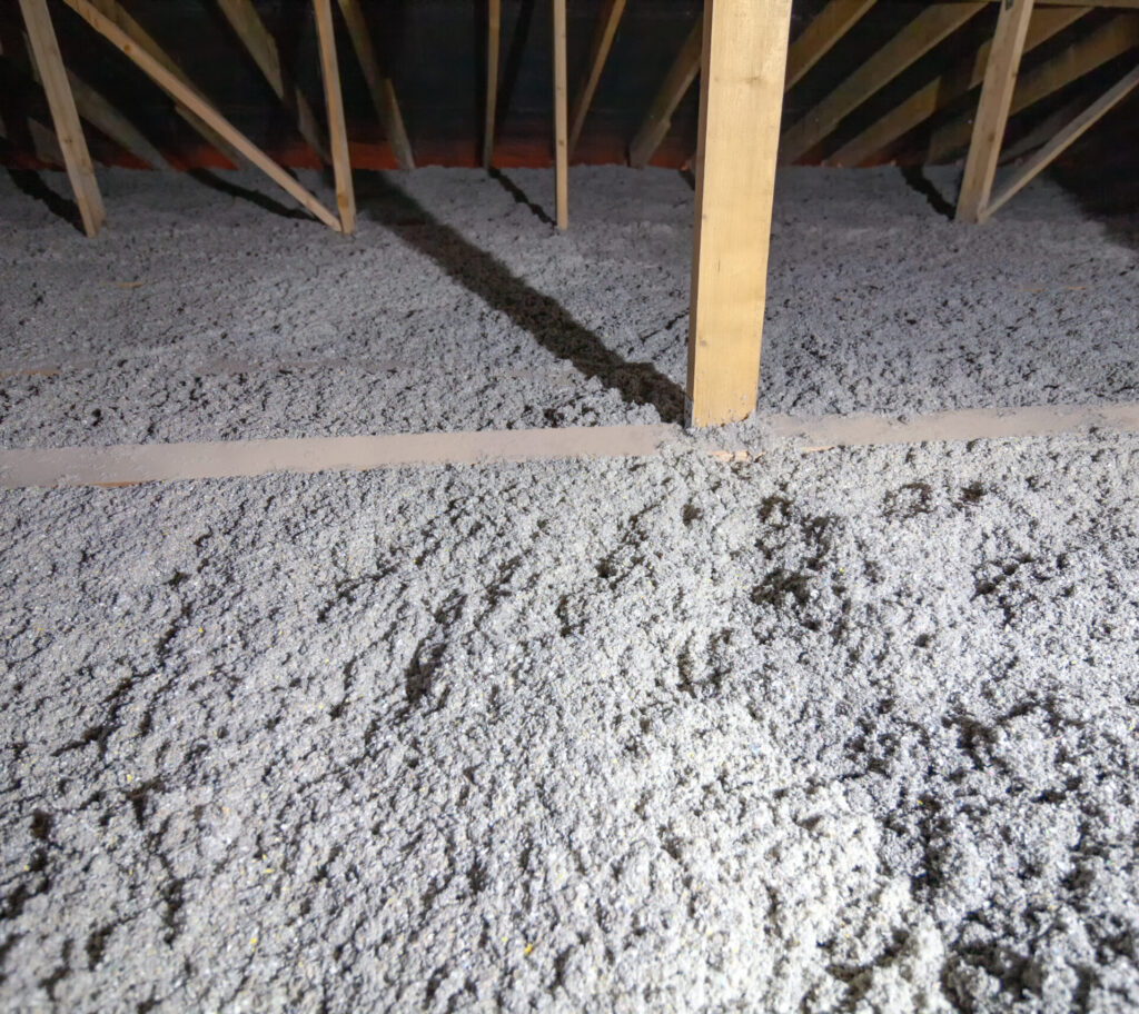 Cellulose insulation being installed in an attic